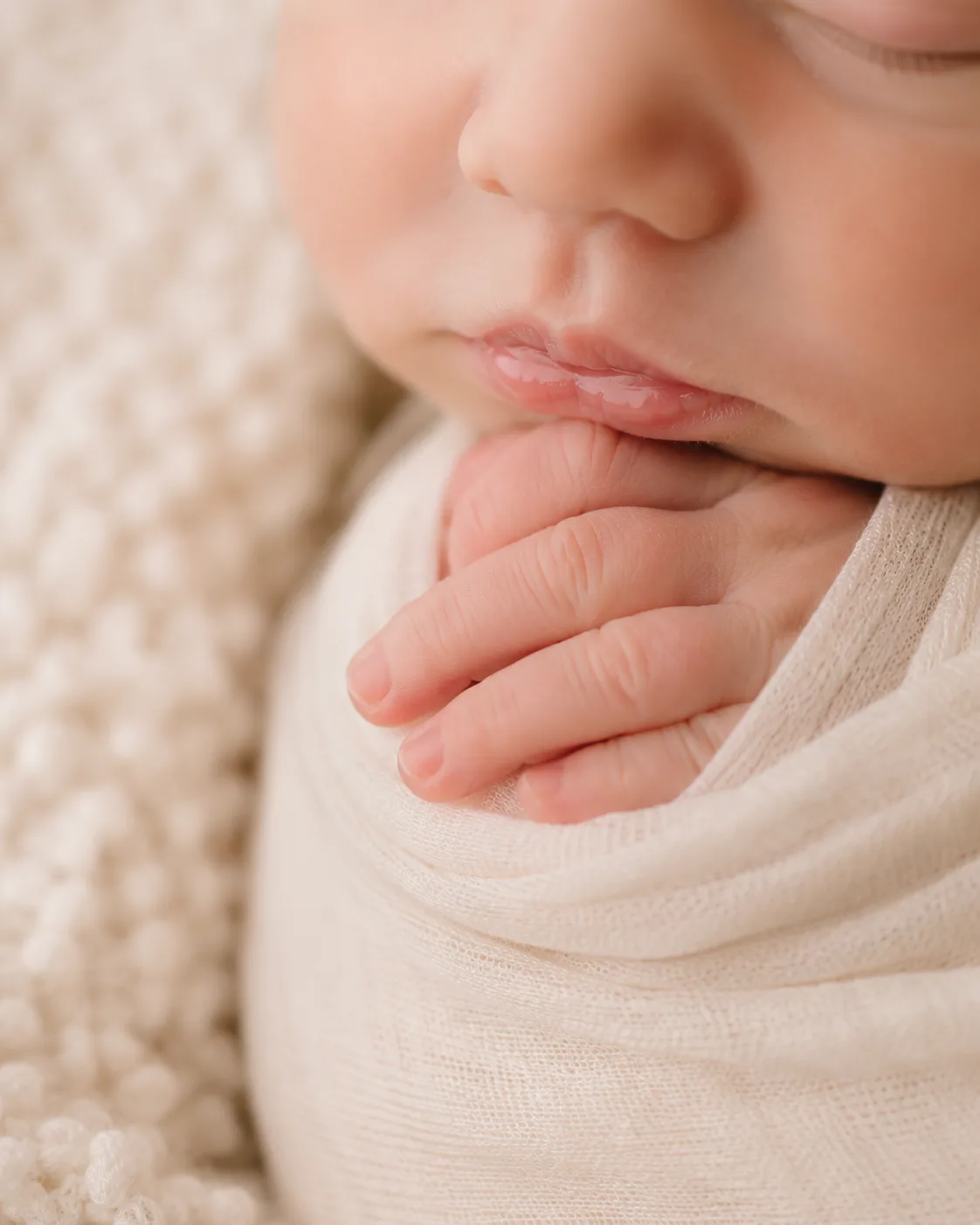Close-up detail of a sleeping newborn baby during a Raleigh newborn photography session