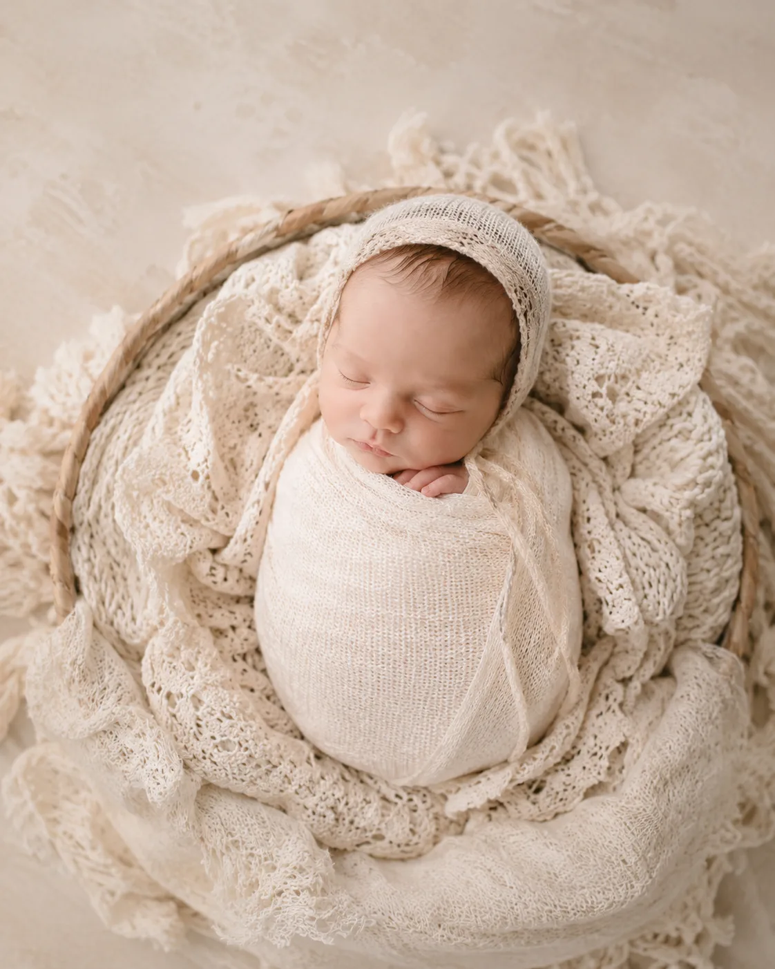 Newborn baby in a gentle studio pose during a Raleigh newborn photography session